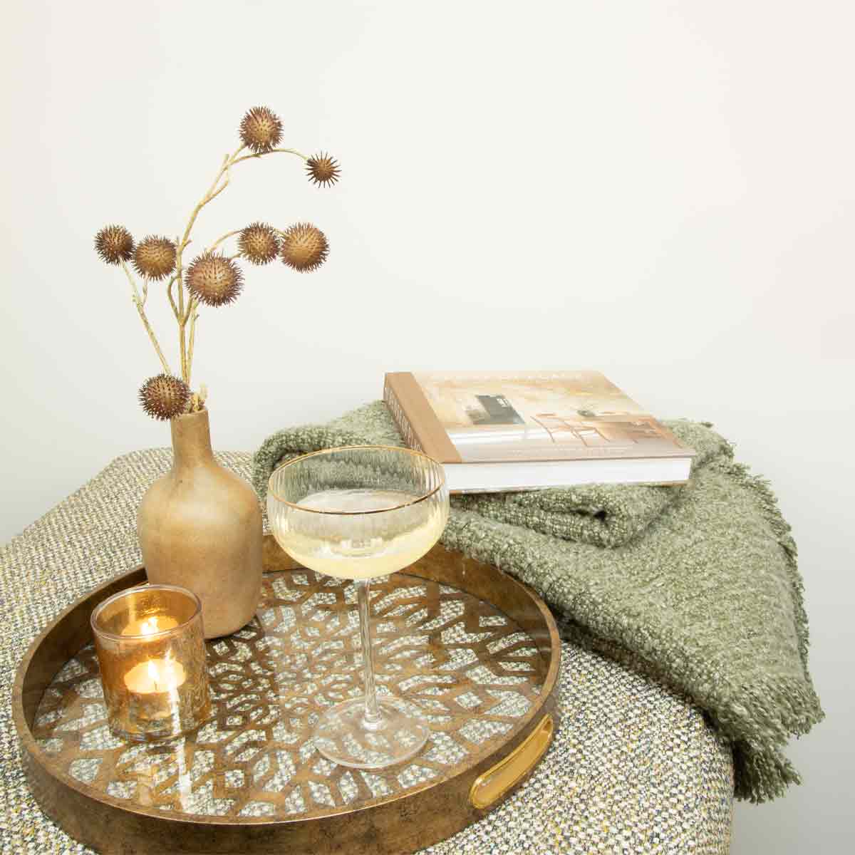 Antique Gold Mosaic Tray styled with glassware, candle and book on side table