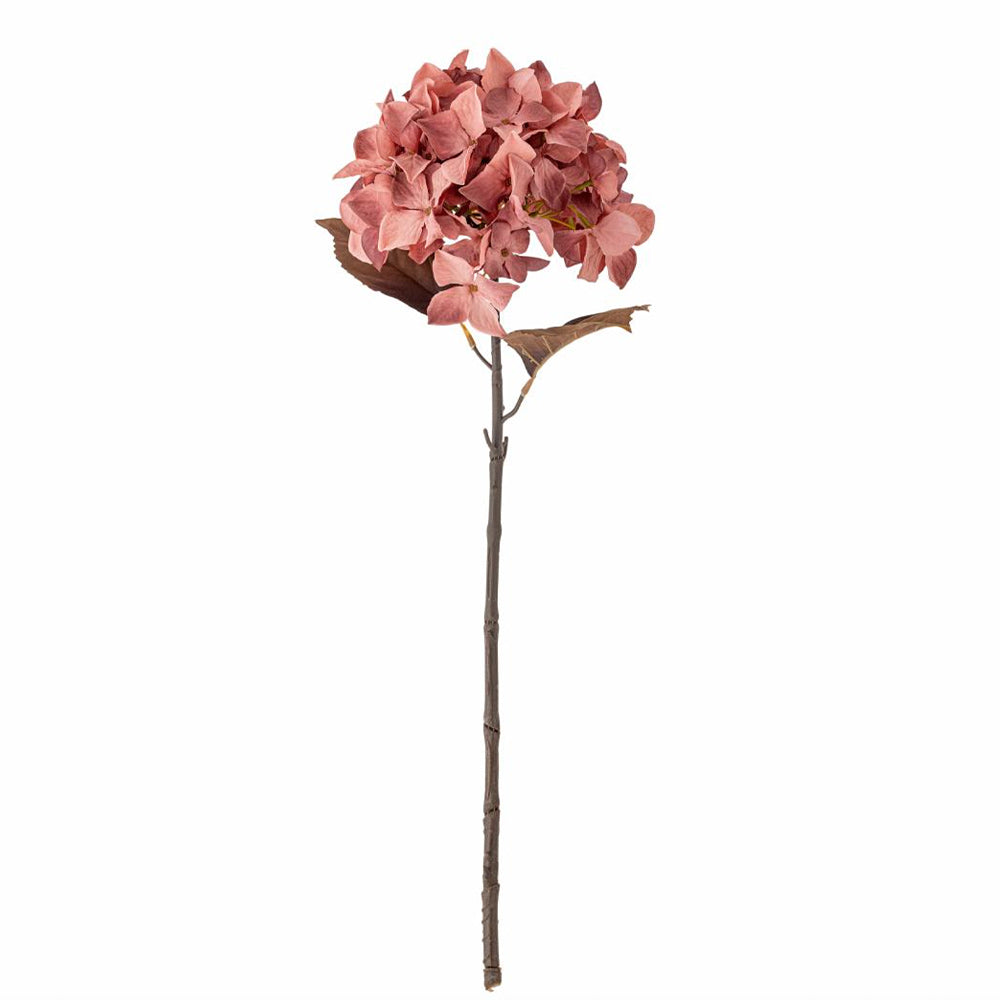 An artificial pink hydrangea stem with multiple clustered pink blossoms, a few brown leaves, and a long brown stem on a plain white background.