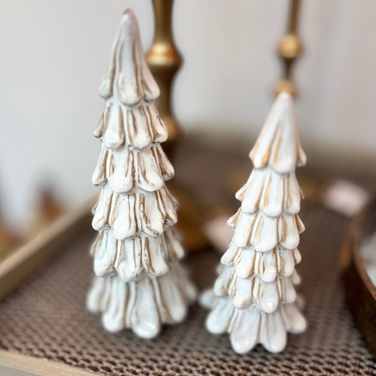 Set of 2 Bertie Off-white Stoneware Christmas trees on a console table