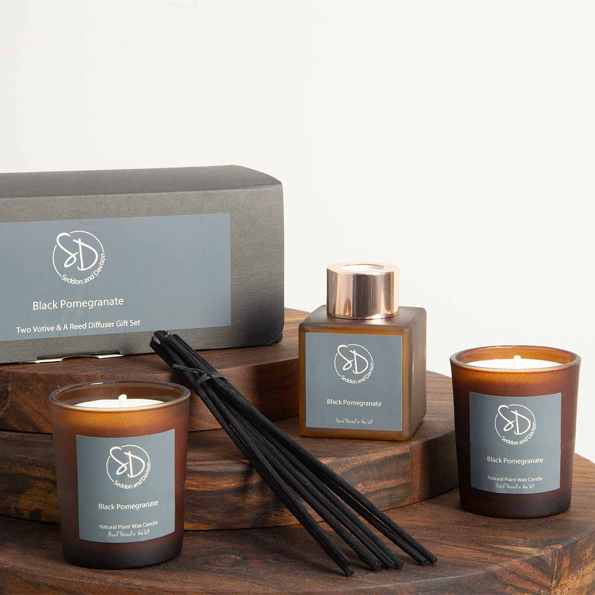 Black Pomegranate Home Fragrance Gift Set – reed diffuser and two votive candles in amber glass - Displayed with box
