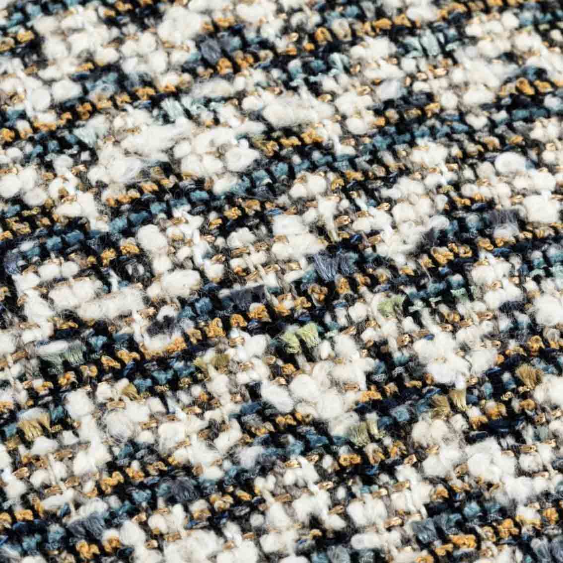 Close-up of the luxury Braden Cushion’s textured woven fabric in blue, cream, and neutral tones.