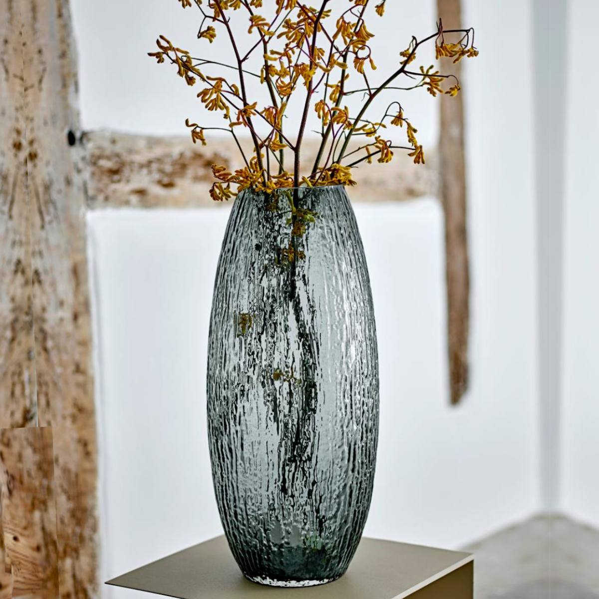 Brock vase displayed on a console table with dried flowers