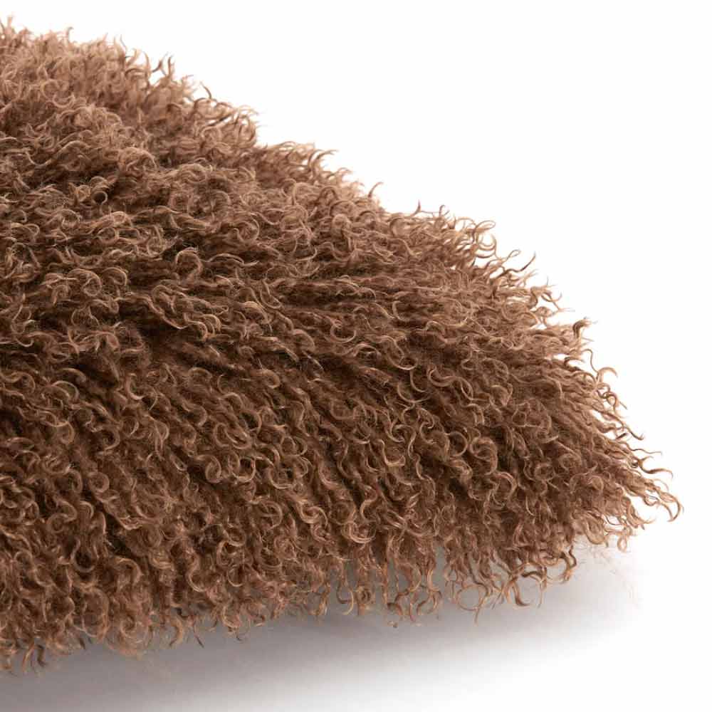 Bubion Faux Fur Square Cushion in Dark Brown with shaggy woolen texture - Close up of corner