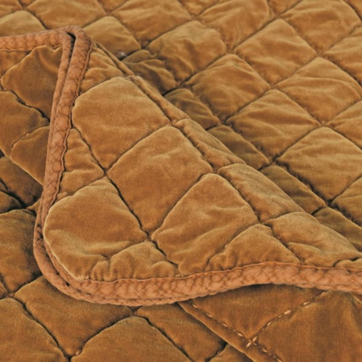 Close-up of a Caramel Quilted Bed Spread - King Size - with diamond pattern
