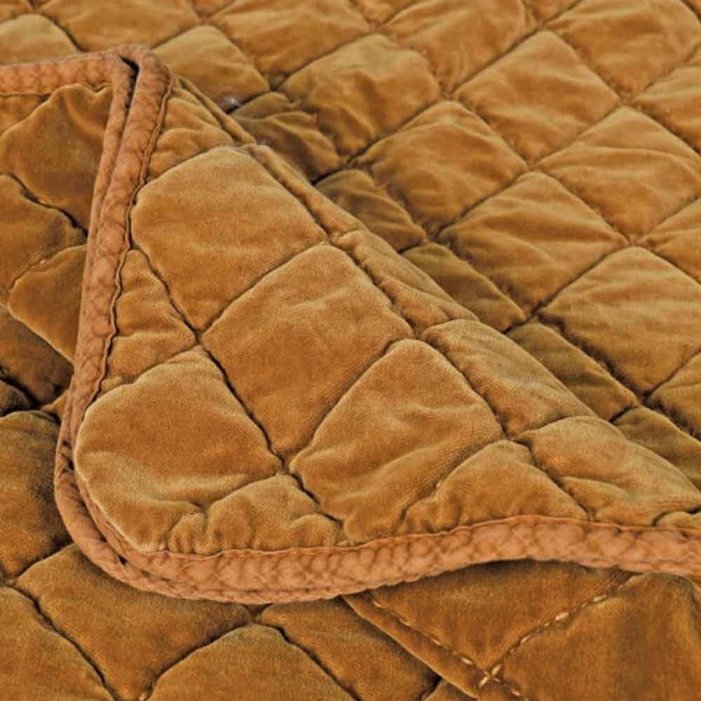 Close-up of a Caramel Quilted Bed Spread - King Size - with diamond pattern