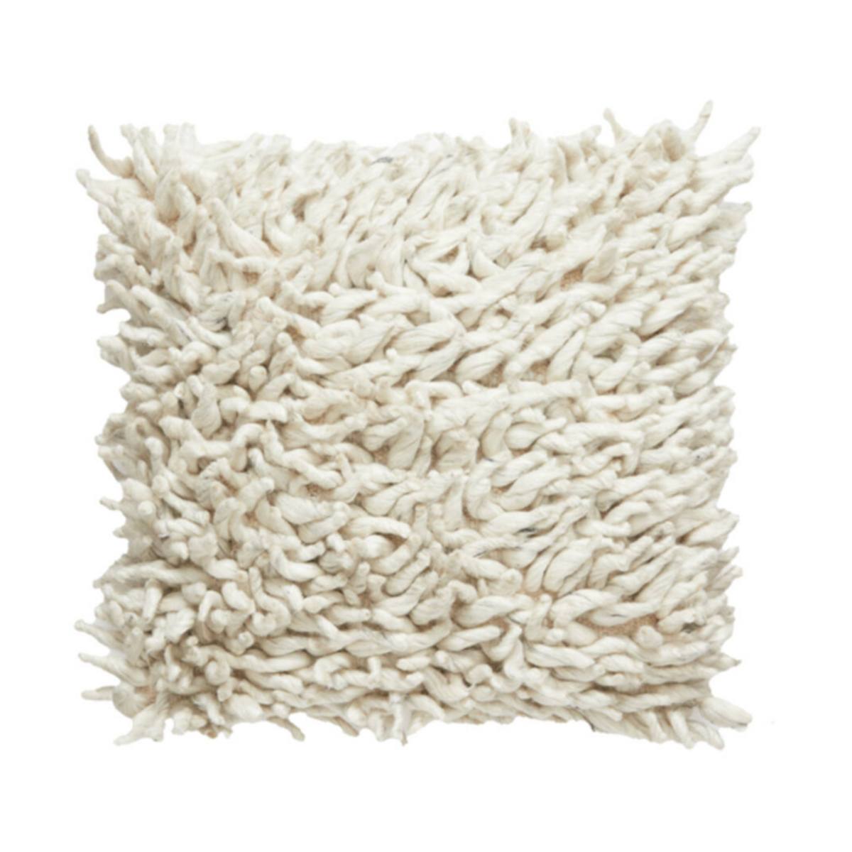 Close-up of a textured comallo cushion in natural on a white background