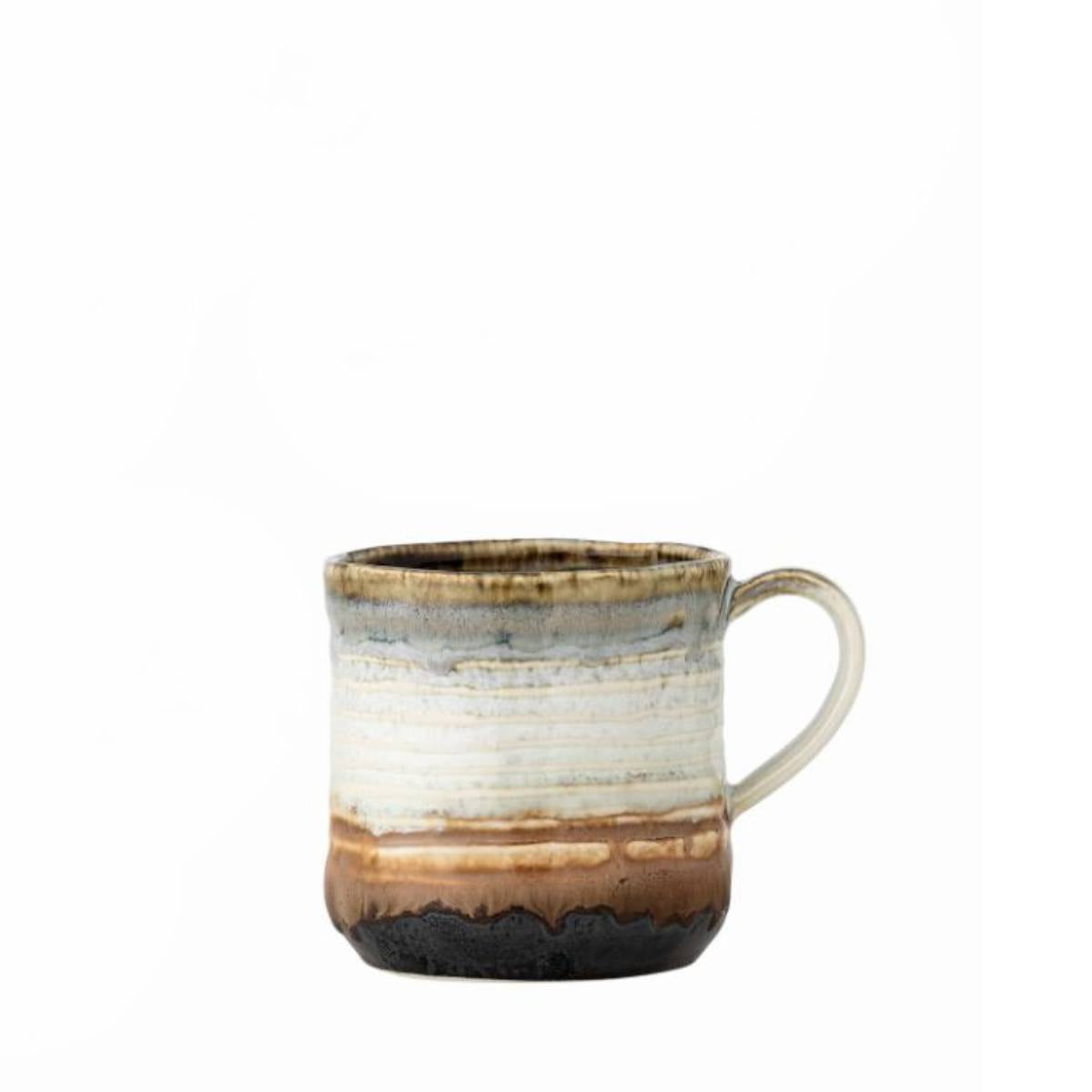 Ceramic Deana mug with brown and white glaze on a white background