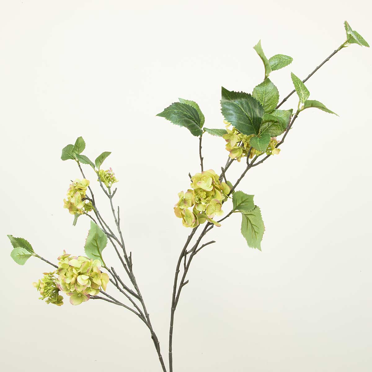 Single stem of artificial green hydrangea spray with multiple branches and green leaves.