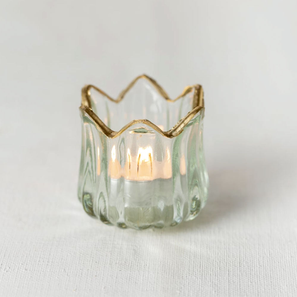 Glass Tulip Tealight Holder with Gold Rim on a white background with lit candle