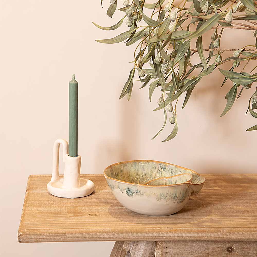 Green Ombre Shell Effect Bowl and candle holder on a wooden surface with a plant in the background