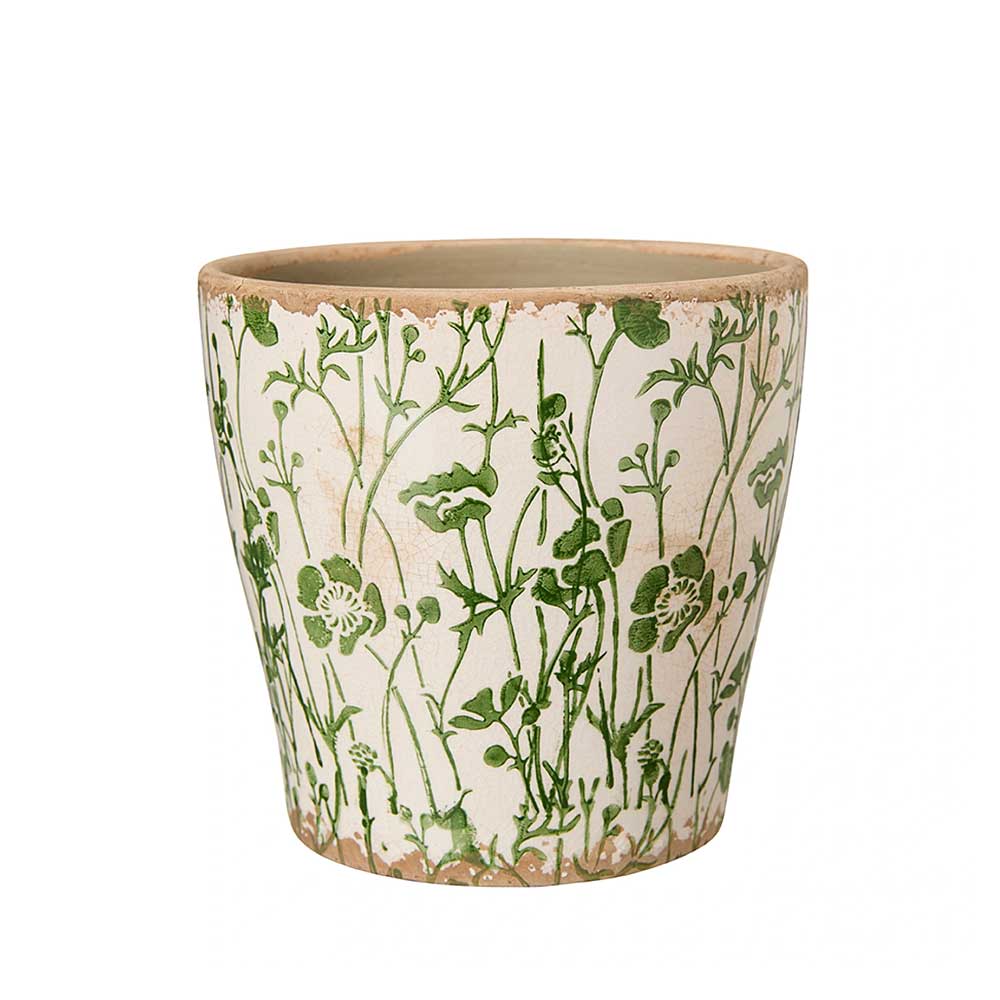 A ceramic planter pot with a green botanical floral pattern on a warm cream-coloured glaze, featuring a rustic terracotta-coloured rim and base.