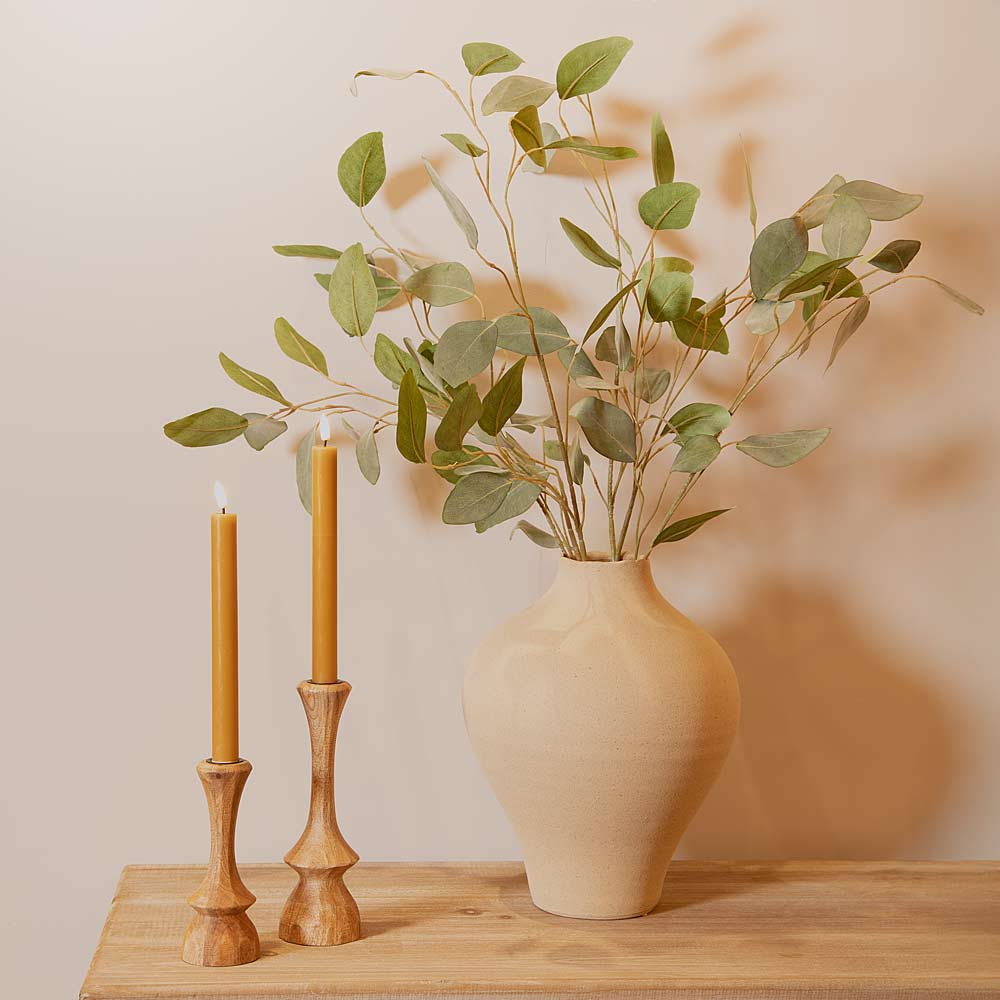 Hesille Ceramic Vase in Linen styled with silver dollar eucalyptus and Cirilo Natural Wood Candlesticks
