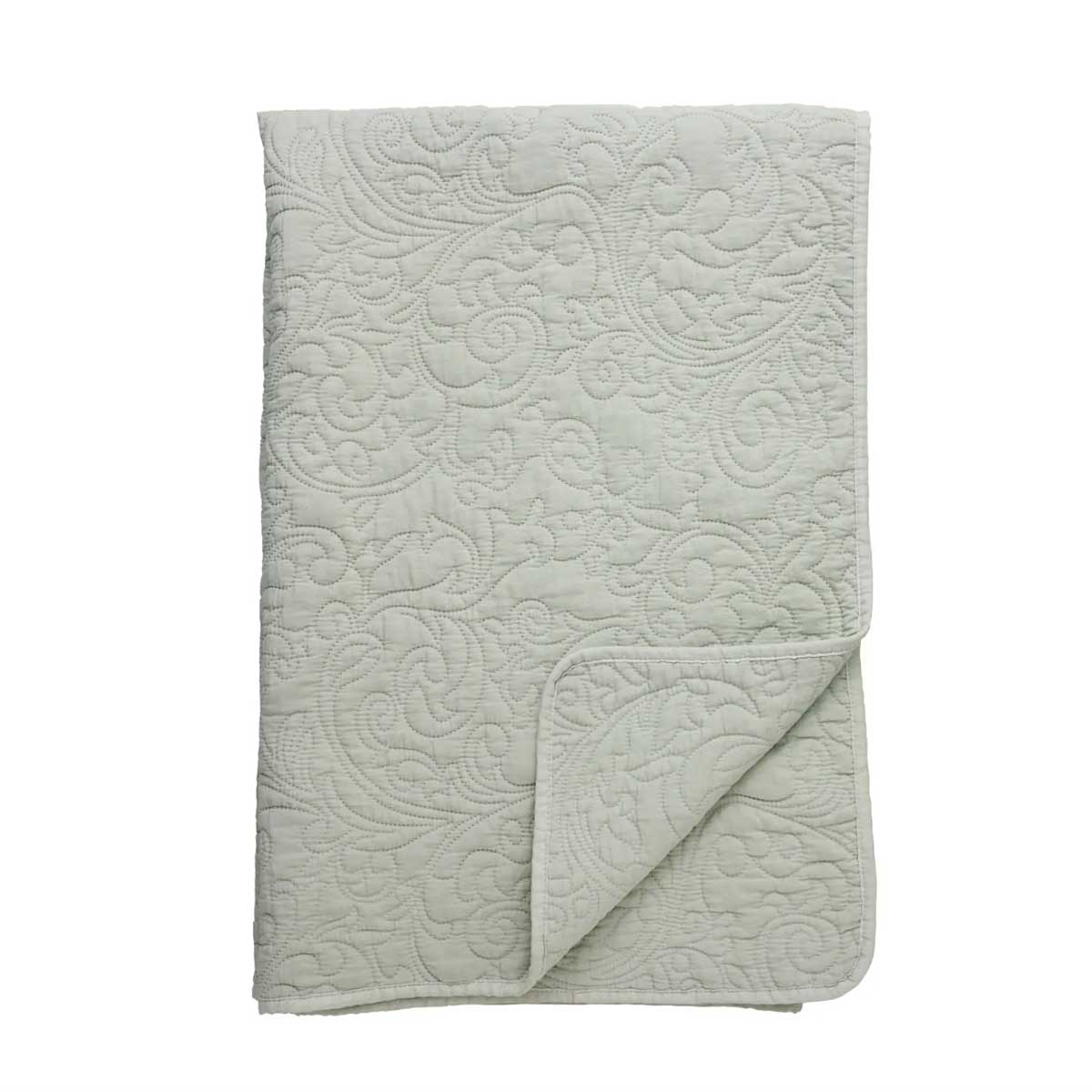 Isabelle Quilted Throw – sage-green quilted throw styled in calm interior