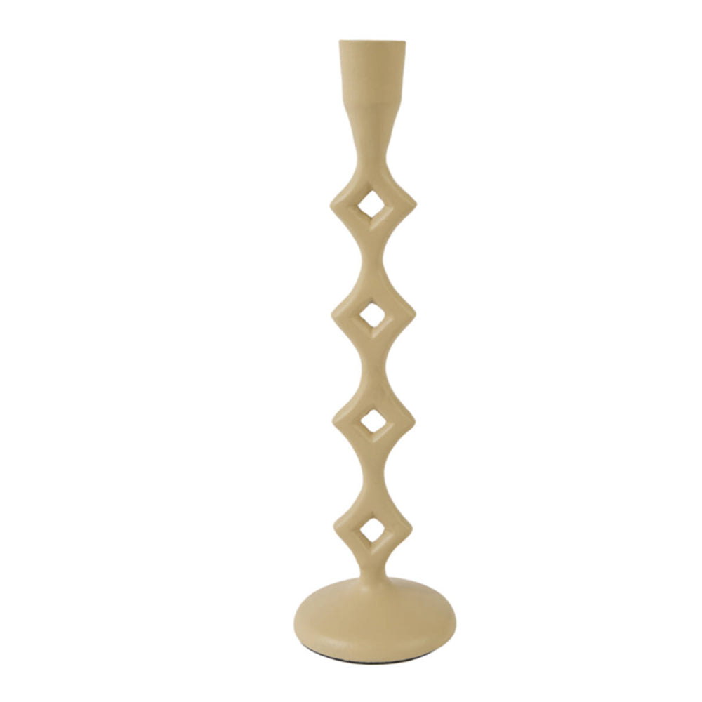 A single cream-colored ceramic candlestick holder with a unique geometric design of stacked diamond shapes, set against a plain white background.