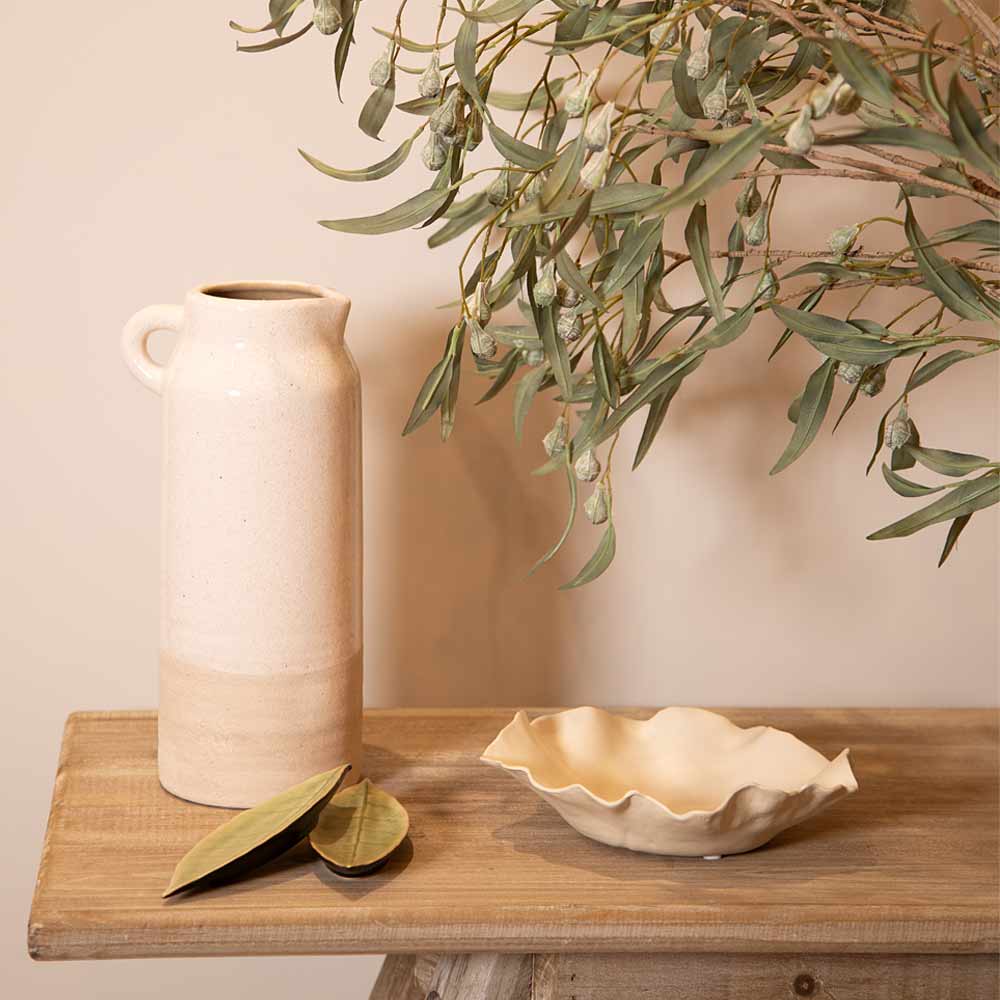 Ceramic Liberec Natural Two Tone Tall Jug and bowl on a wooden surface with greenery in the background
