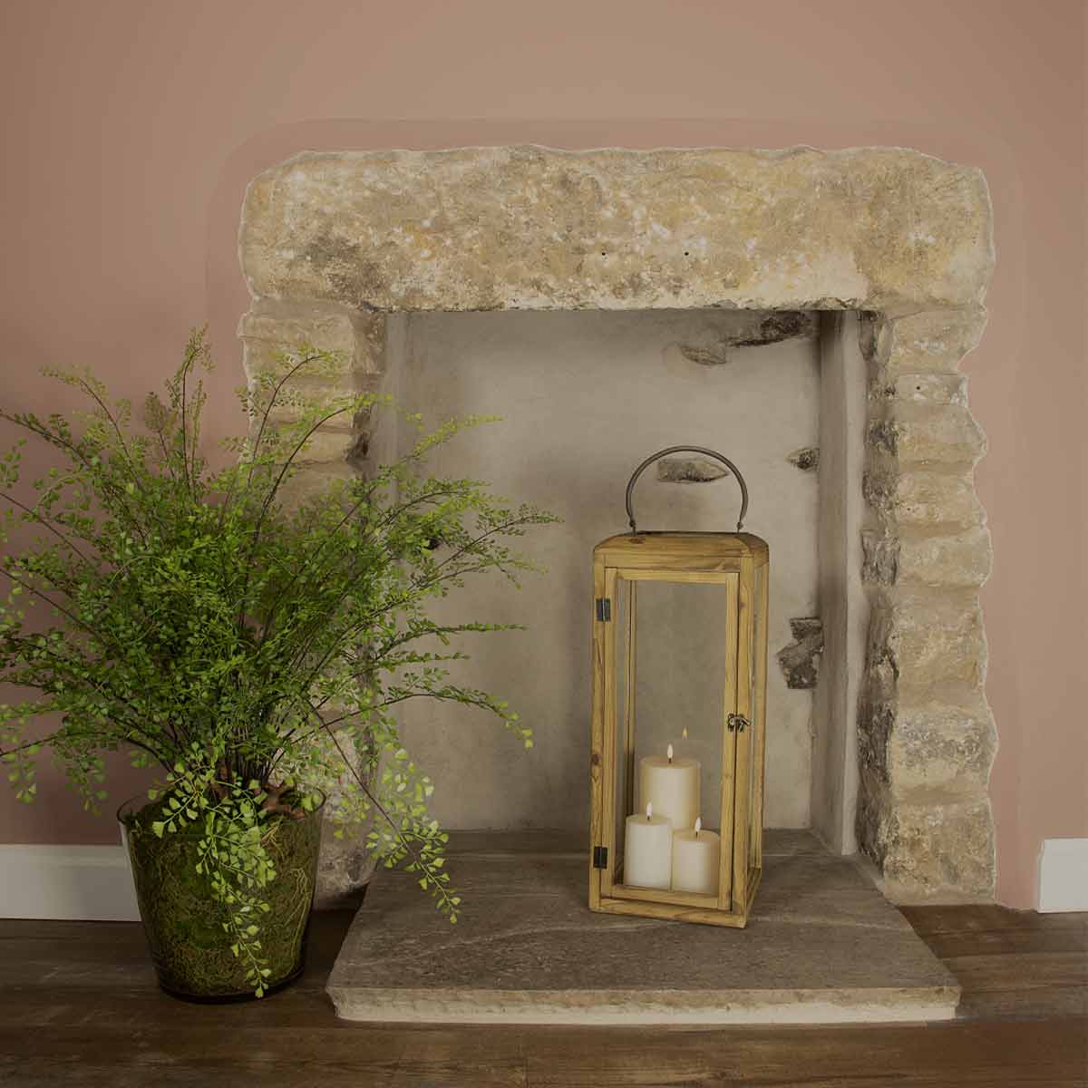 Large illy Wooden Lantern – natural wood and glass lanterns styled in a stone fireplace with candles and greenery