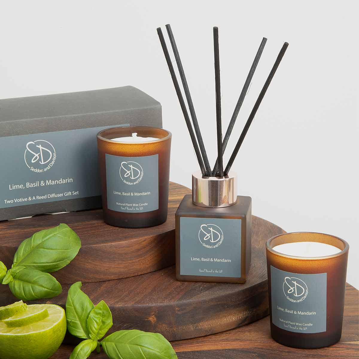 Lime Basil and Mandarin Home Fragrance Gift Set – reed diffuser and two votive candles in amber glass with black reeds