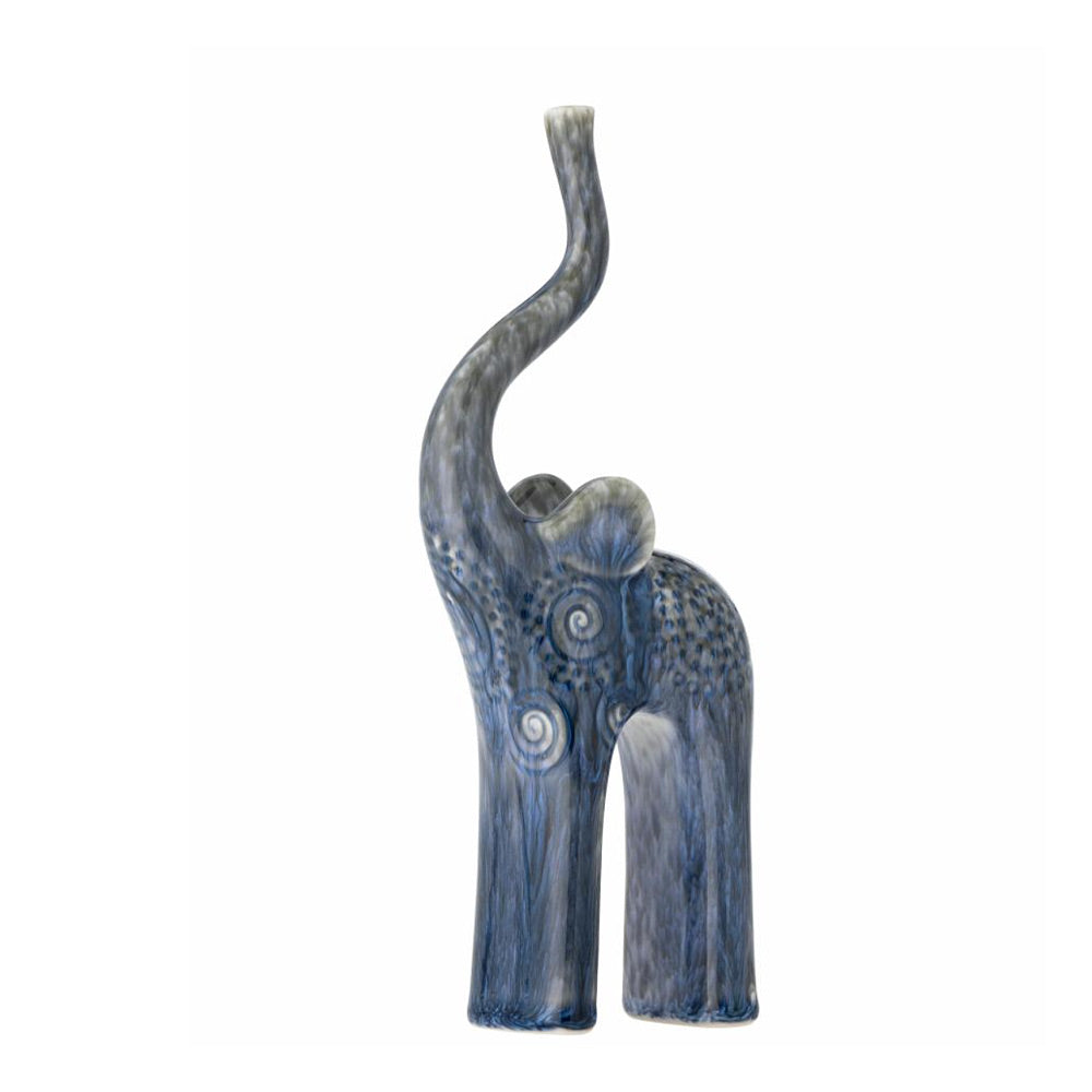 Longuro blue reactive-glazed ceramic elephant with wave patterns on a white background