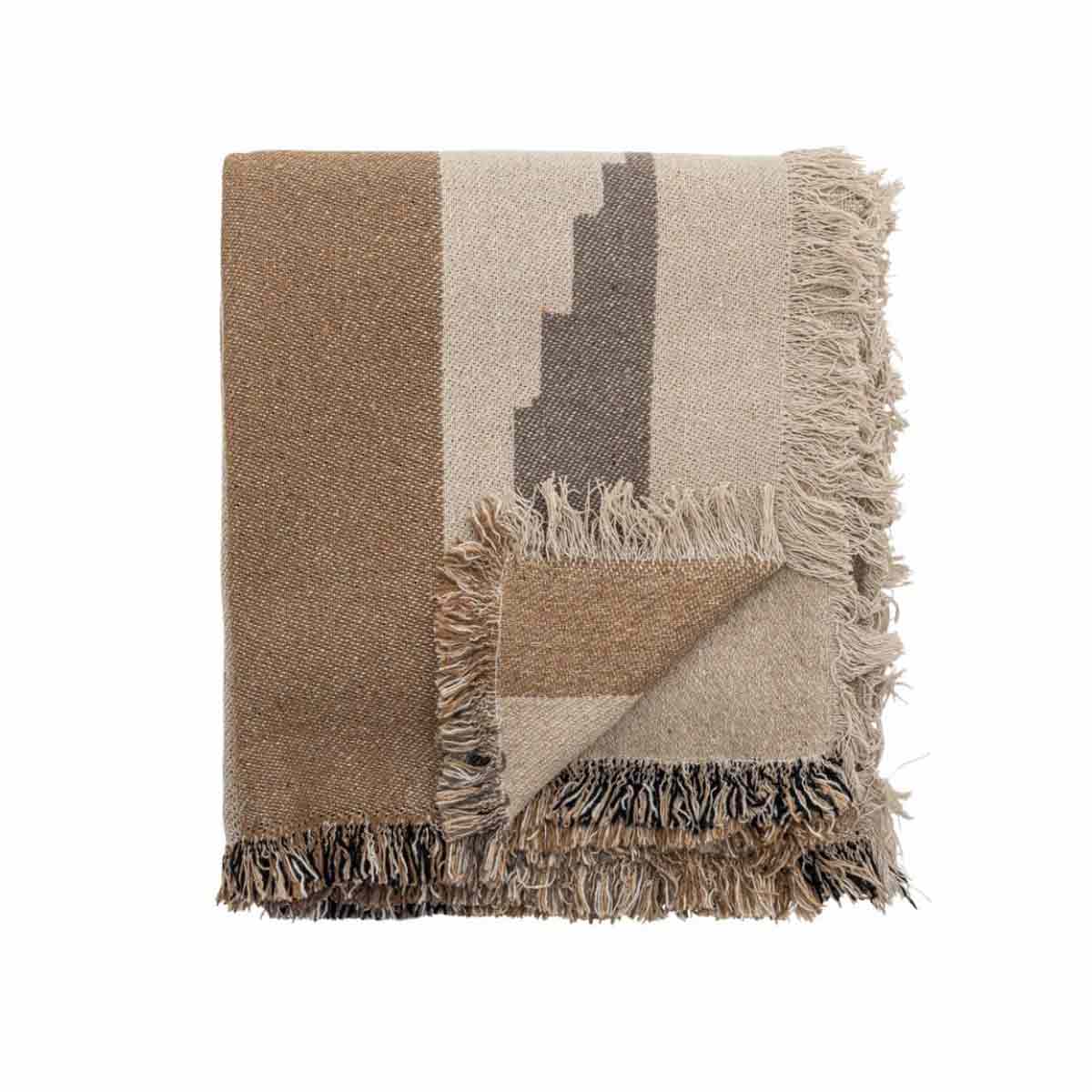 Maji Throw – a woven recycled cotton blanket in warm brown and beige tones with a subtle geometric pattern and fringed edges.