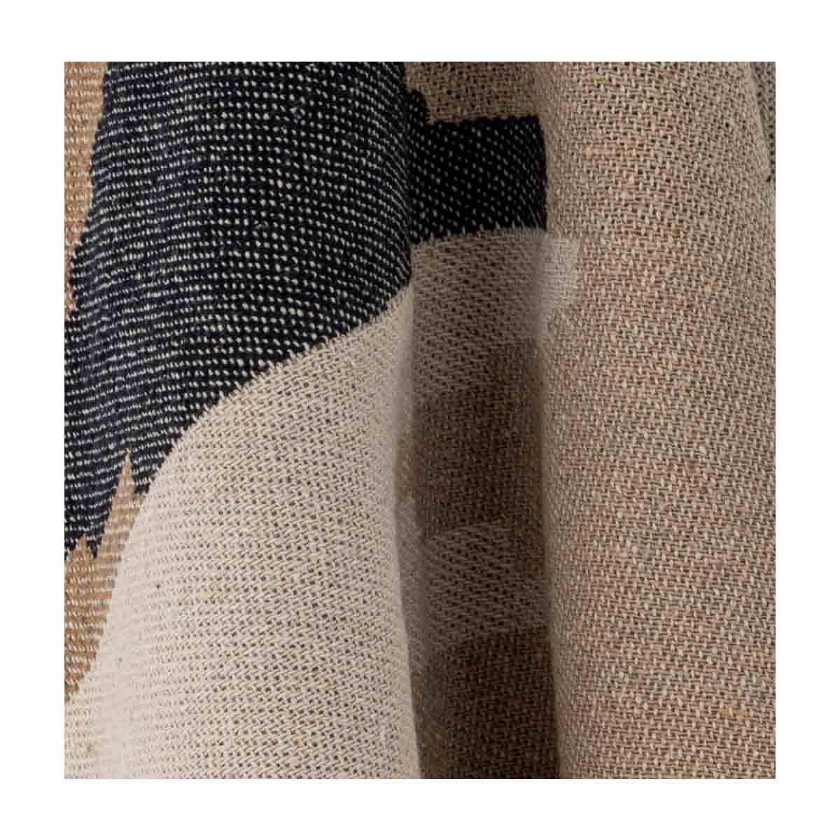 Maji Throw – a woven recycled cotton blanket in warm brown and beige tones with a subtle geometric pattern and fringed edges - close up of print.