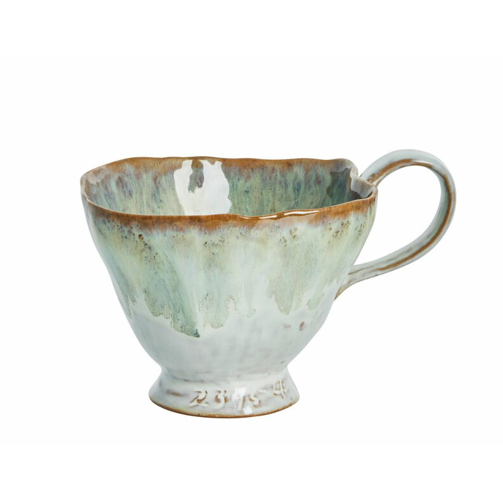 Ceramic Milla Reactive Glaze Mug in Green mug with a textured surface on a white background