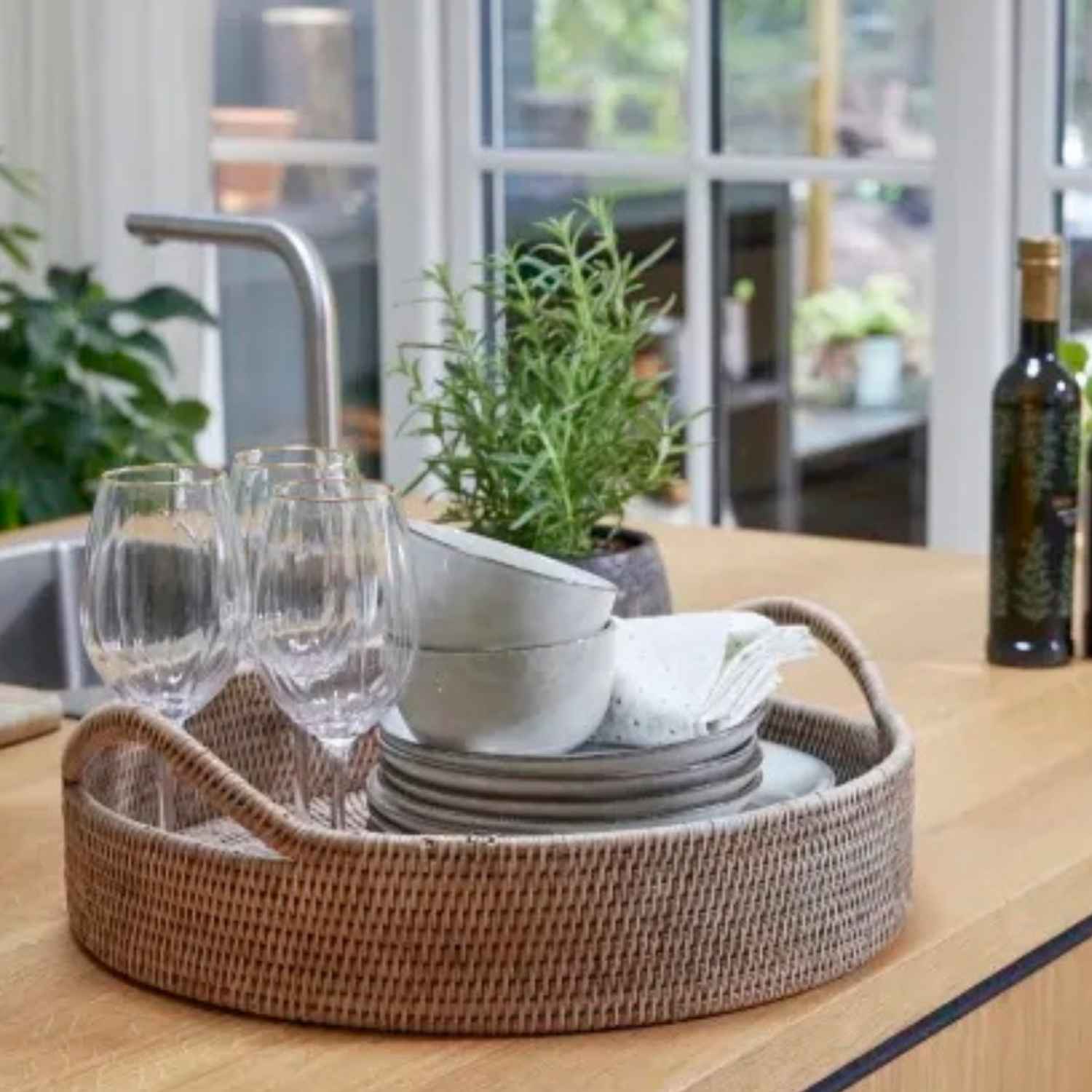 Norah Round Rattan Tray- On Kitchen Sideboard with glasses