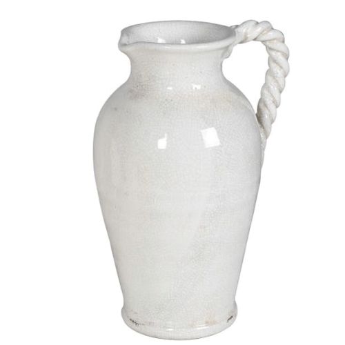 Off-white ceramic jug with twisted handle styled