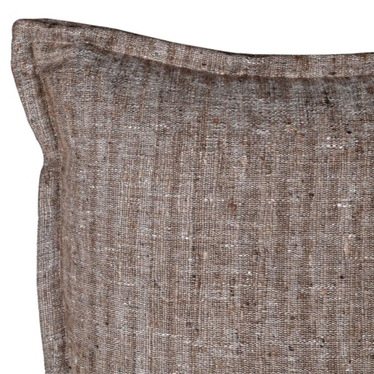 Close-up of a textured brown Raw Silk Cushion on a white background