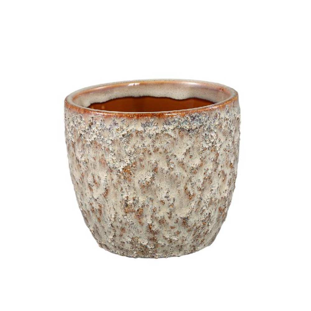 Textured ceramic pot on a white background