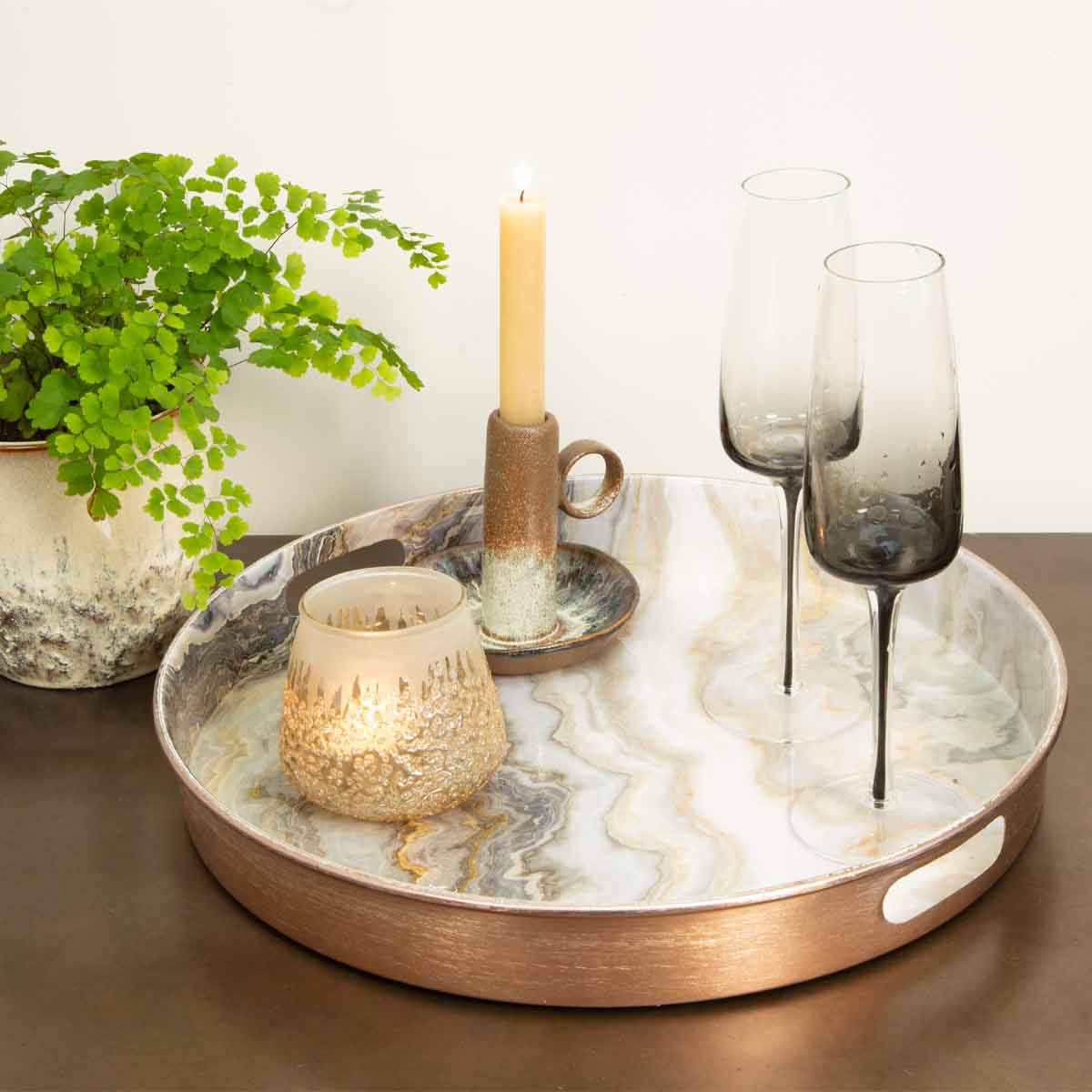 Rose Gold Marble Effect Tray styled with candles and glasses on a dark surface