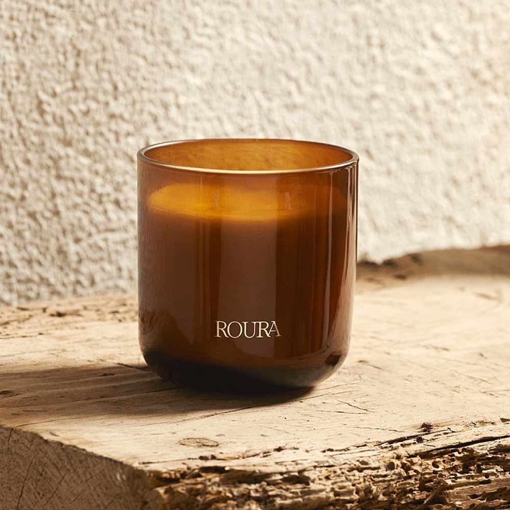 Royal Amber 3 Wick Candle by Roura on a wooden surface