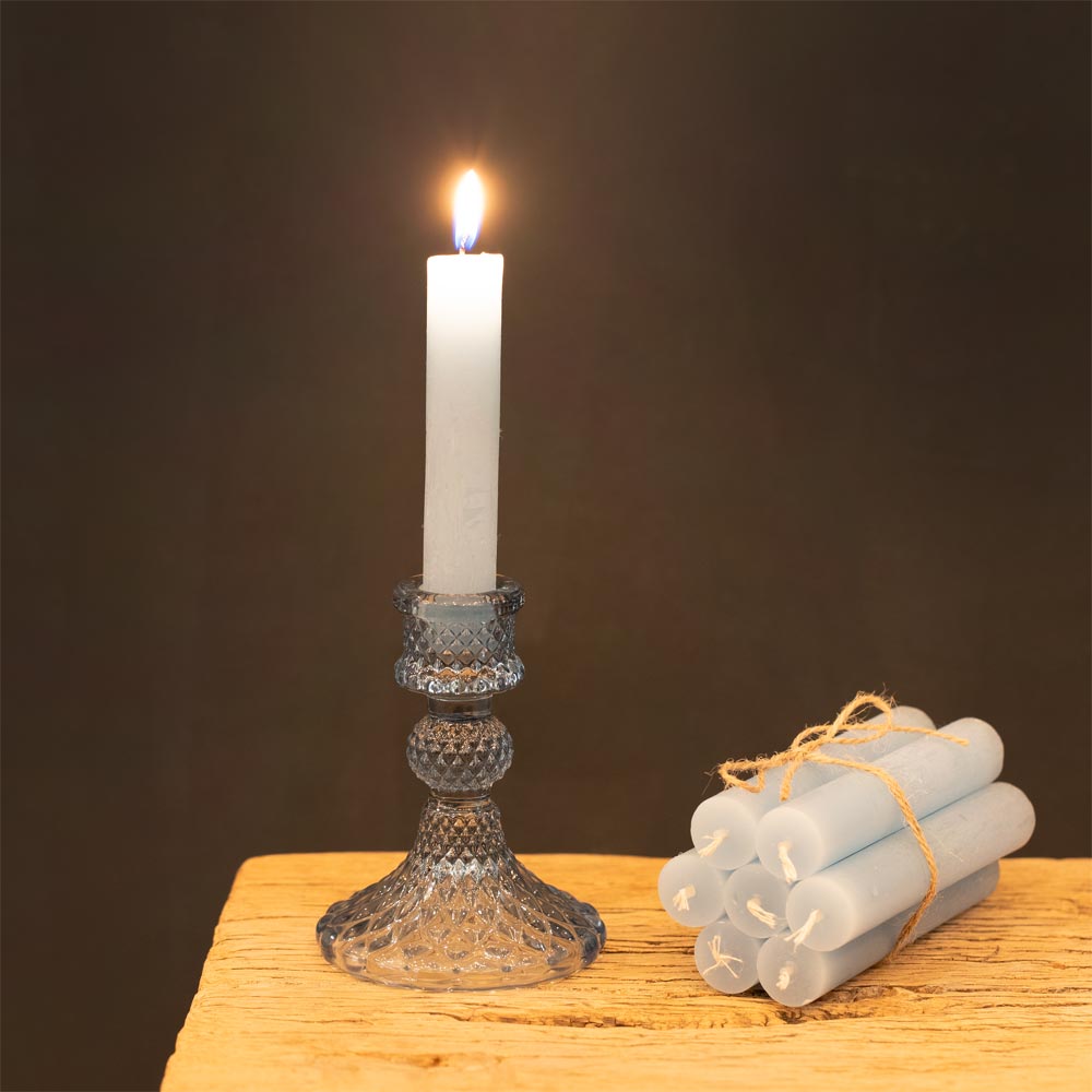 Short Rustic Dinner Candle - Sky Blue Candle in a decorative holder with additional candles on a wooden surface against a dark background
