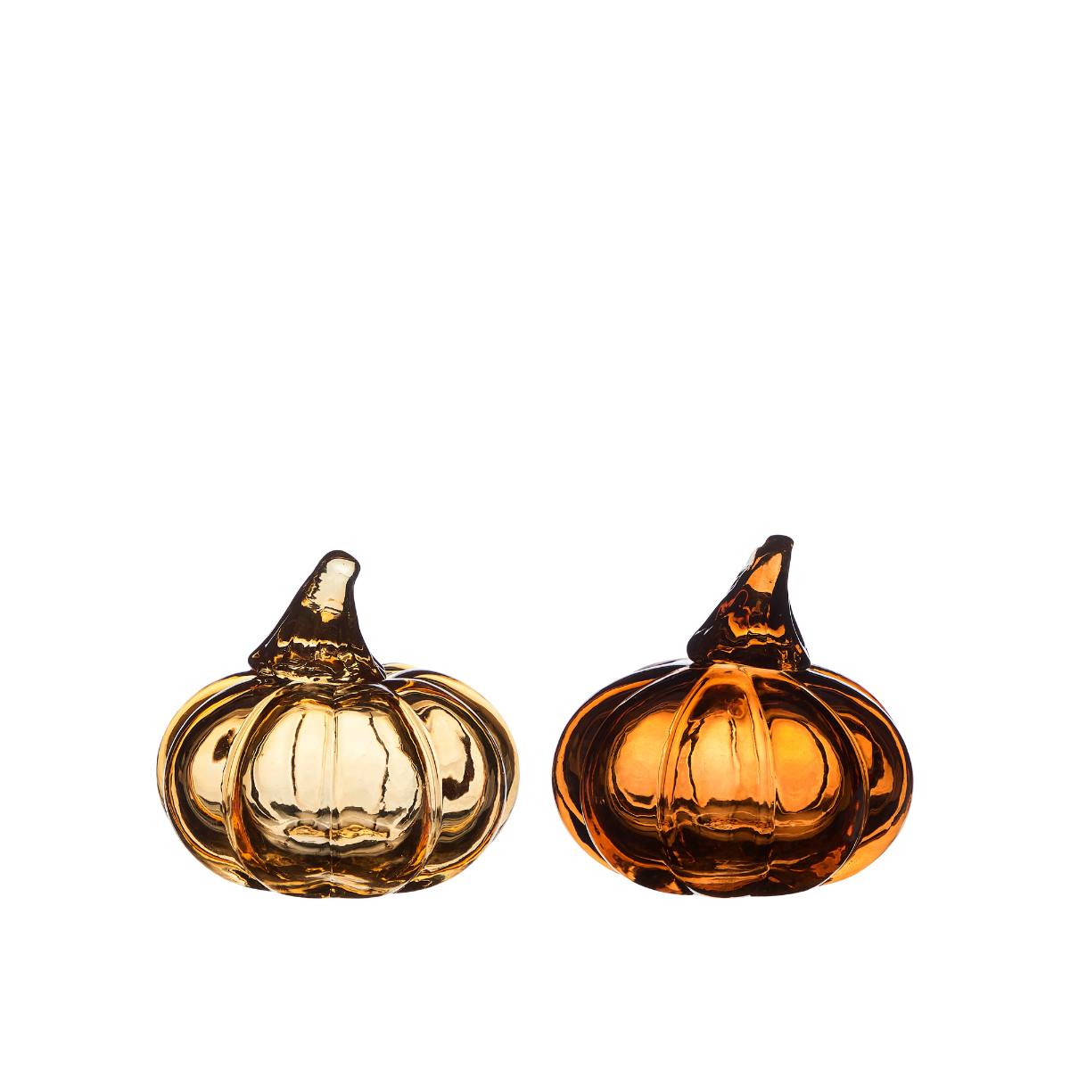 Two amber glass pumpkins, one light and one dark, on a white background