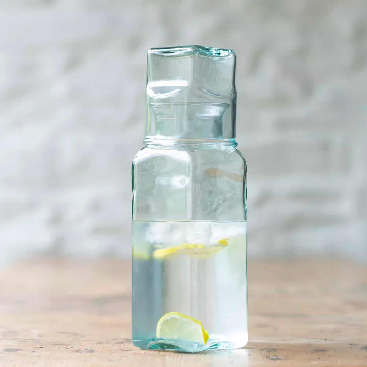 Square Carafe and Glass Set – recycled clear glass with matching top glass on wooden surface