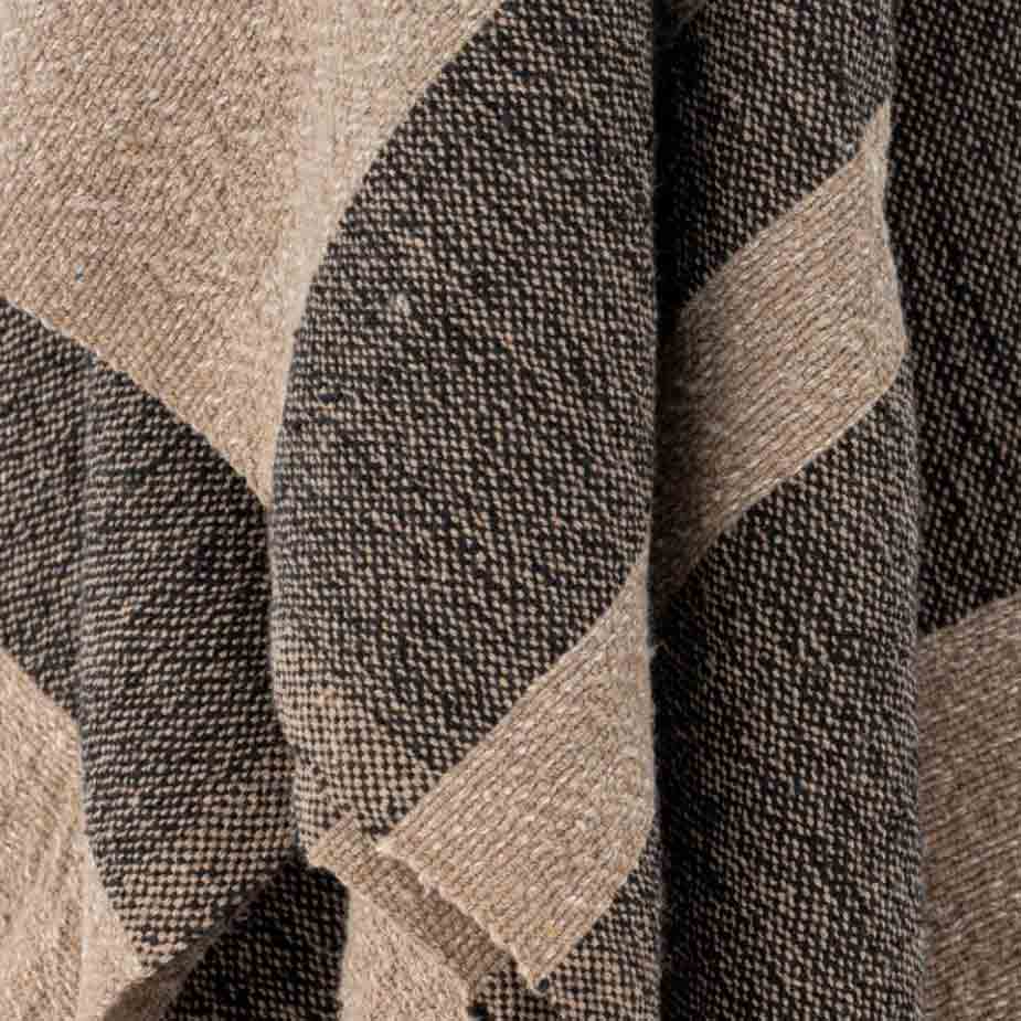 Temi Throw in Black and beige stry with Tassels, Recycled Cotton - Close up of pattern and textured material.
