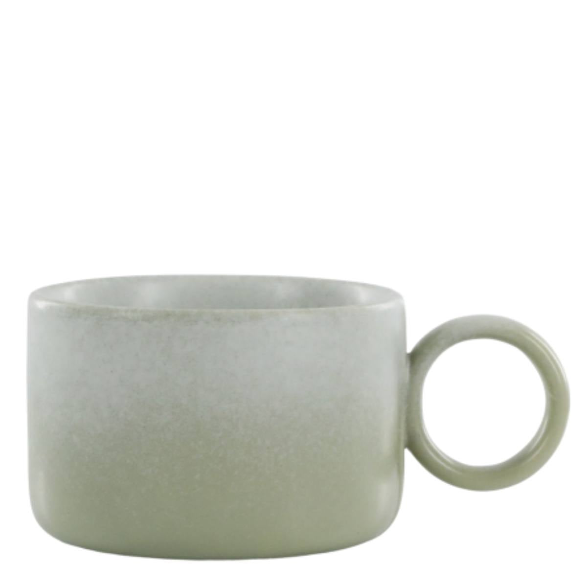 Handmade verte green Valence porcelain mug showing reactive glaze and rounded shape
