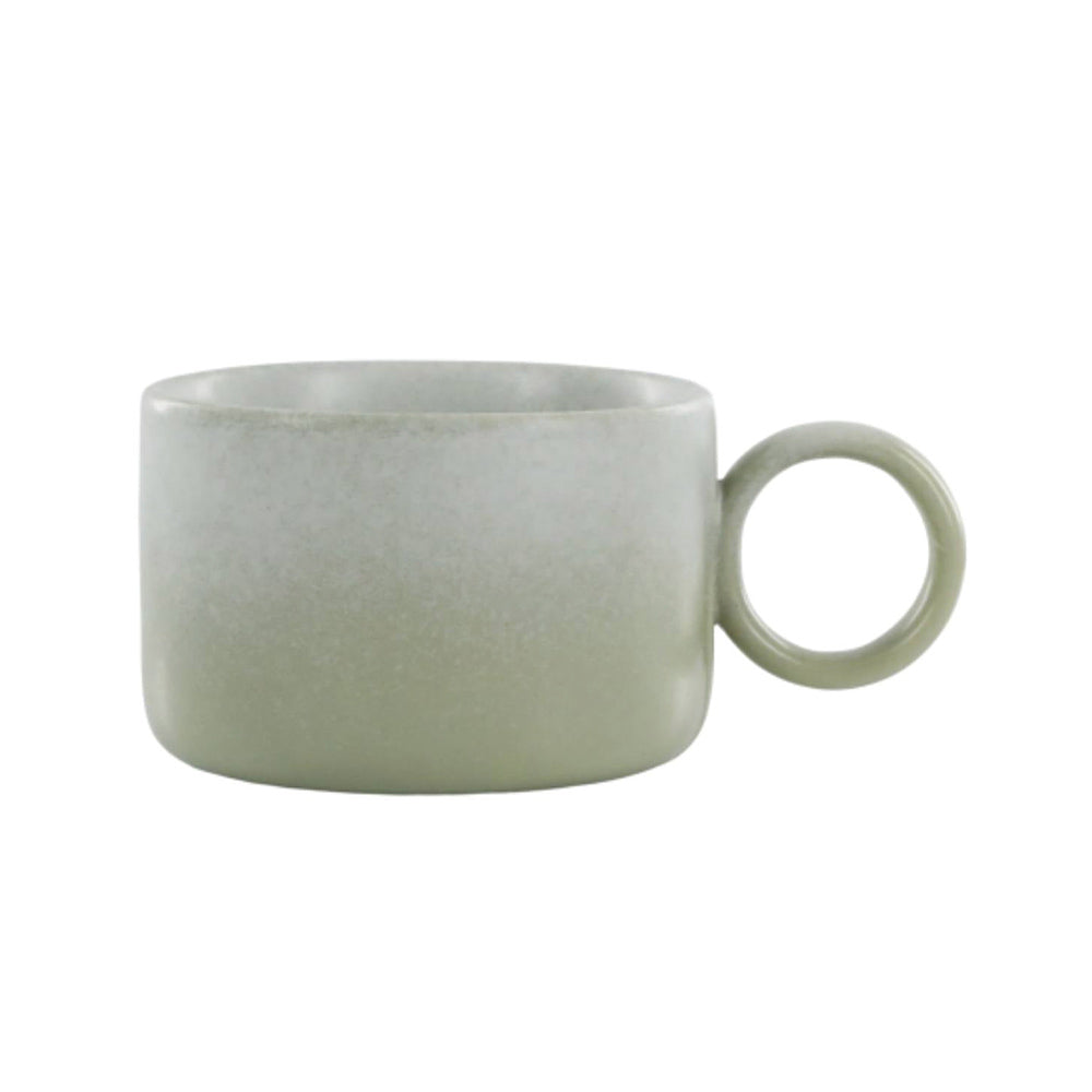 Handmade verte green Valence porcelain mug showing reactive glaze and rounded shape