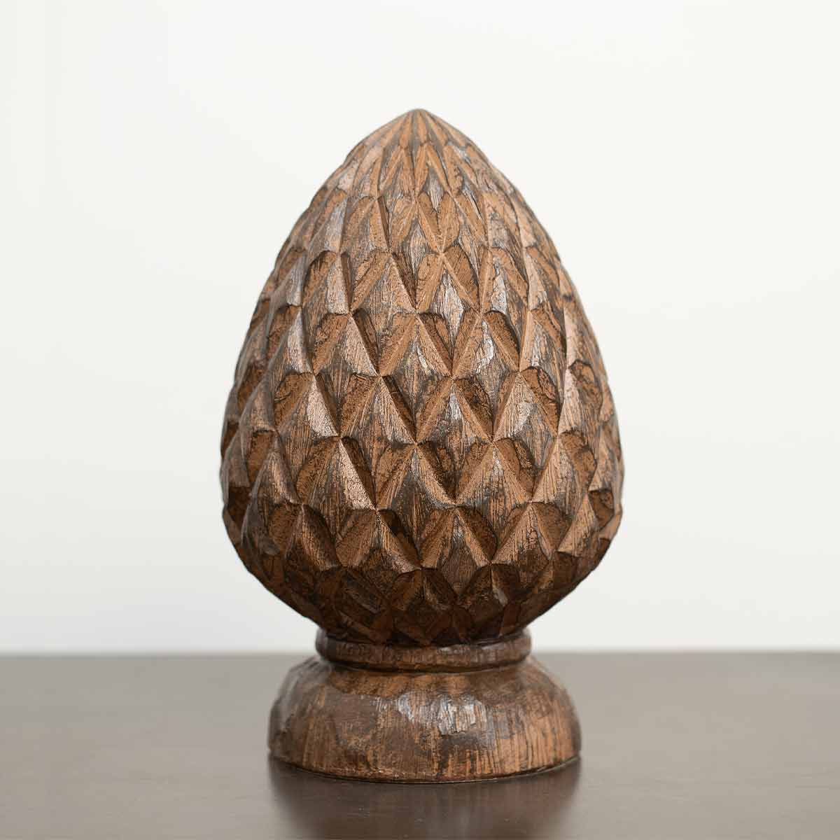 Wood effect artichoke sculpture with carved texture and warm brown finish