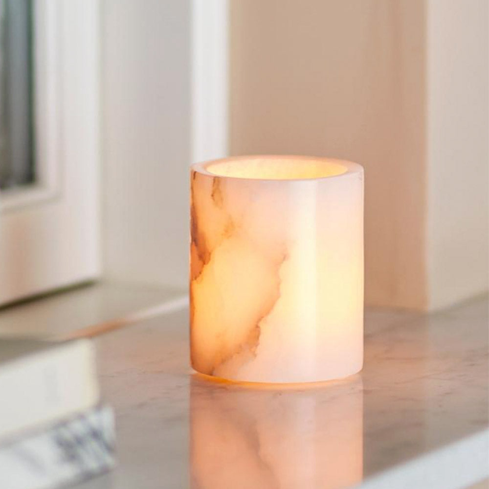 Annabel white alabaster tealight holder with natural veining and polished finish on white background