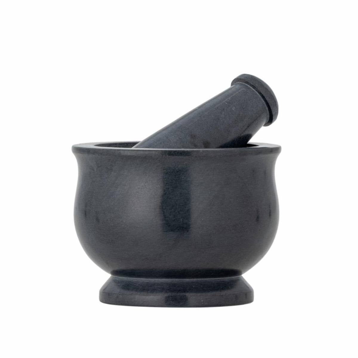 Black mortar and pestle on a white background