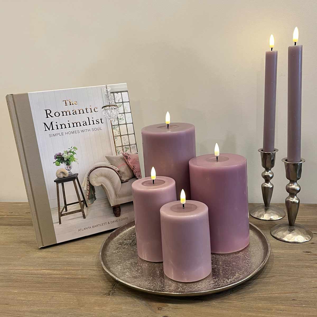 Heather LED dinner and pillar candles styled with book and tray