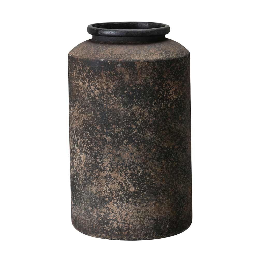 A rustic, cylindrical metal vase with a textured, speckled finish in dark brown and black tones, isolated on a white background.