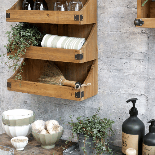 Ares Bowls set of 5 - Verte - displayed in a rustic kitchen setting with stone walls and wooden work top. Displayed with garlic and seasonings.