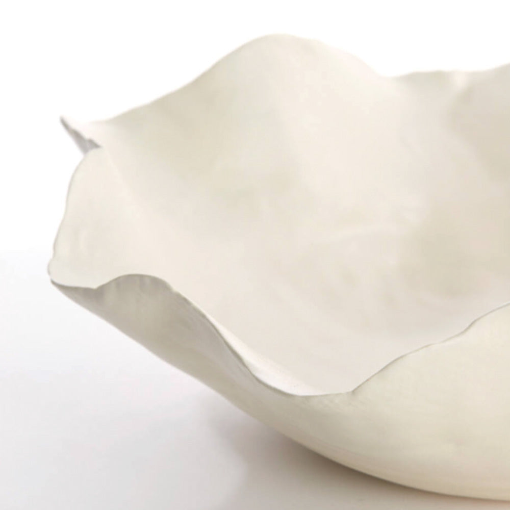 Close up of Banda Ceramic Dish In Cream on a white background