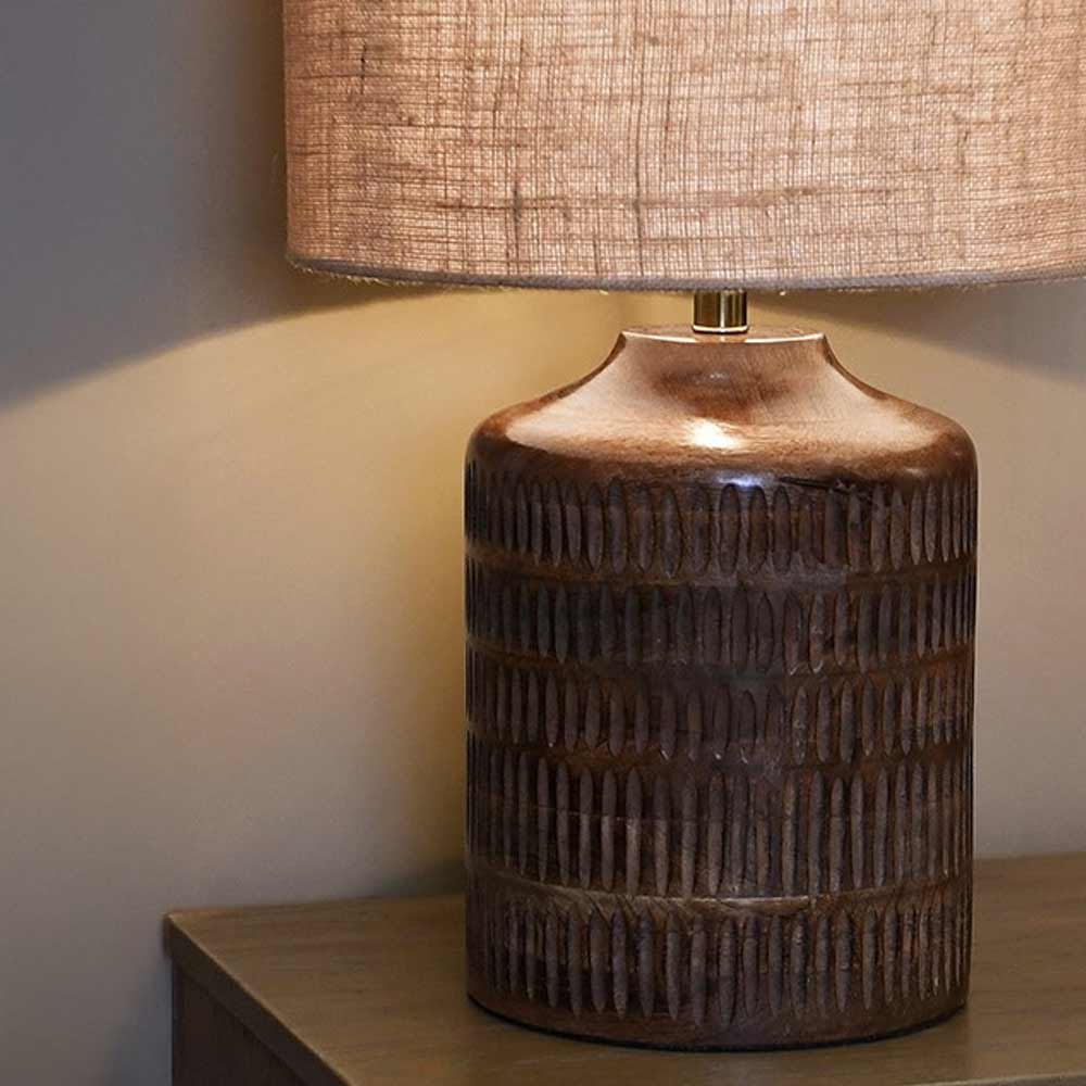 Carved Ridged Table Lamp with mango wood base and jute shade styled on a console table