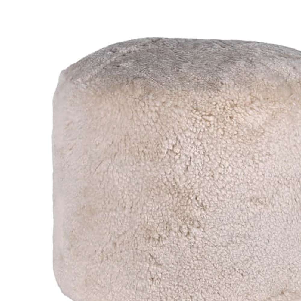 Cream round pouffe made from real sheepskin - Close up of texture