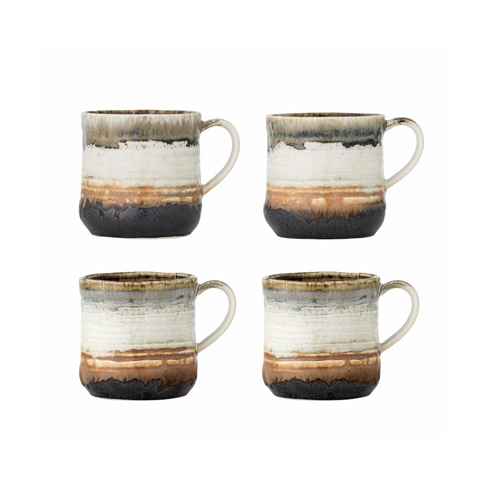 Ceramic Deana mug with brown and white glaze on a white background