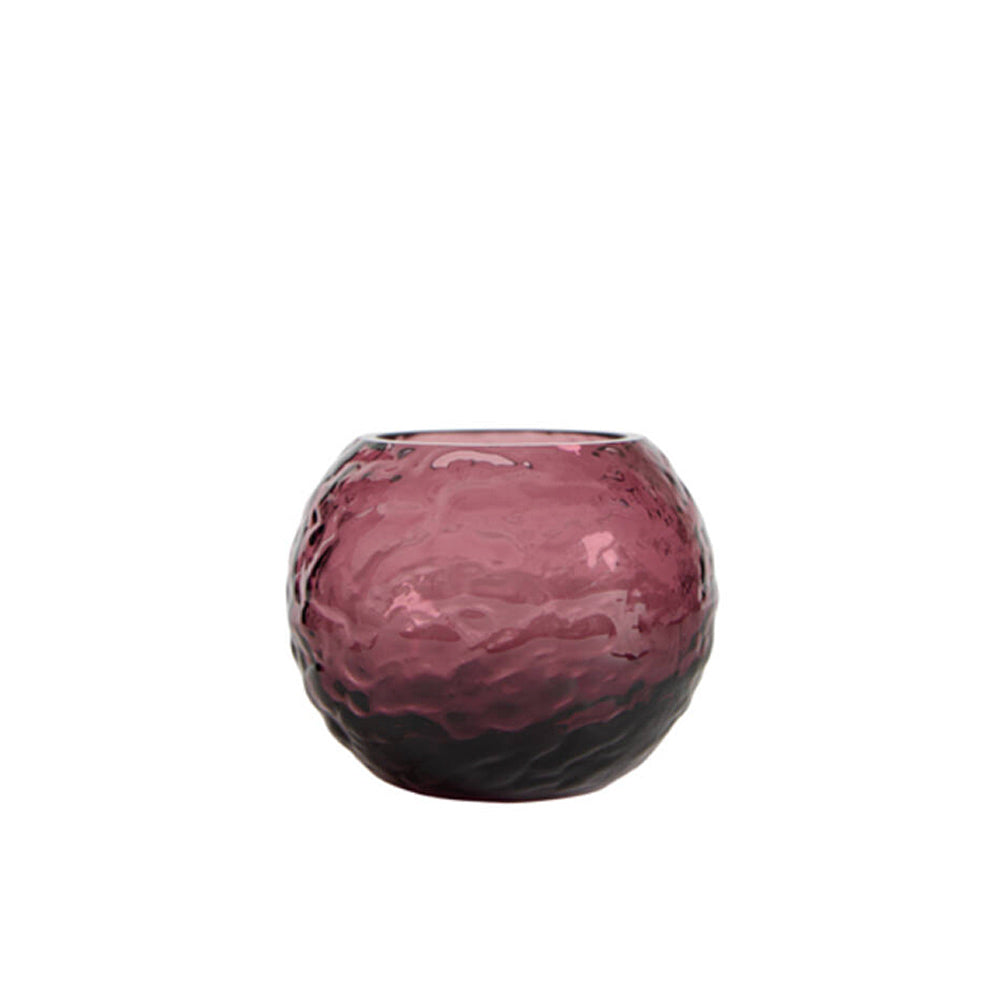 A small, round, textured glass candle holder  in a deep  plum colour, shown against a plain white background.