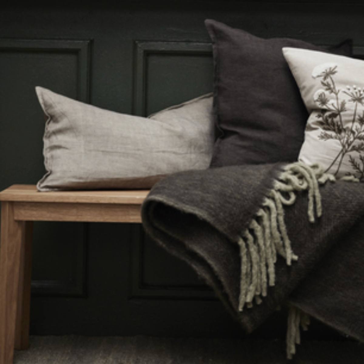 Efina Oblong Cushion - Linen - styled on rustic bench with throws