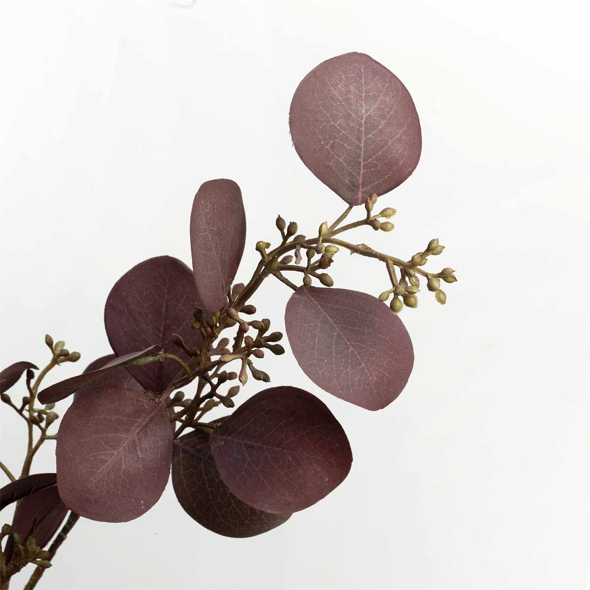 Close up of faux eucalyptus spray with rounded leaves in deep aubergine-purple tones.